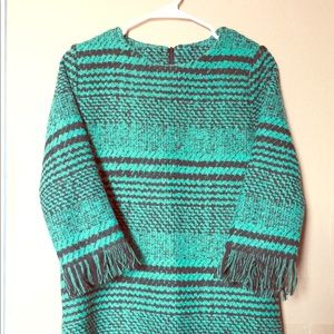 A short warm green dress, perfect for winter.